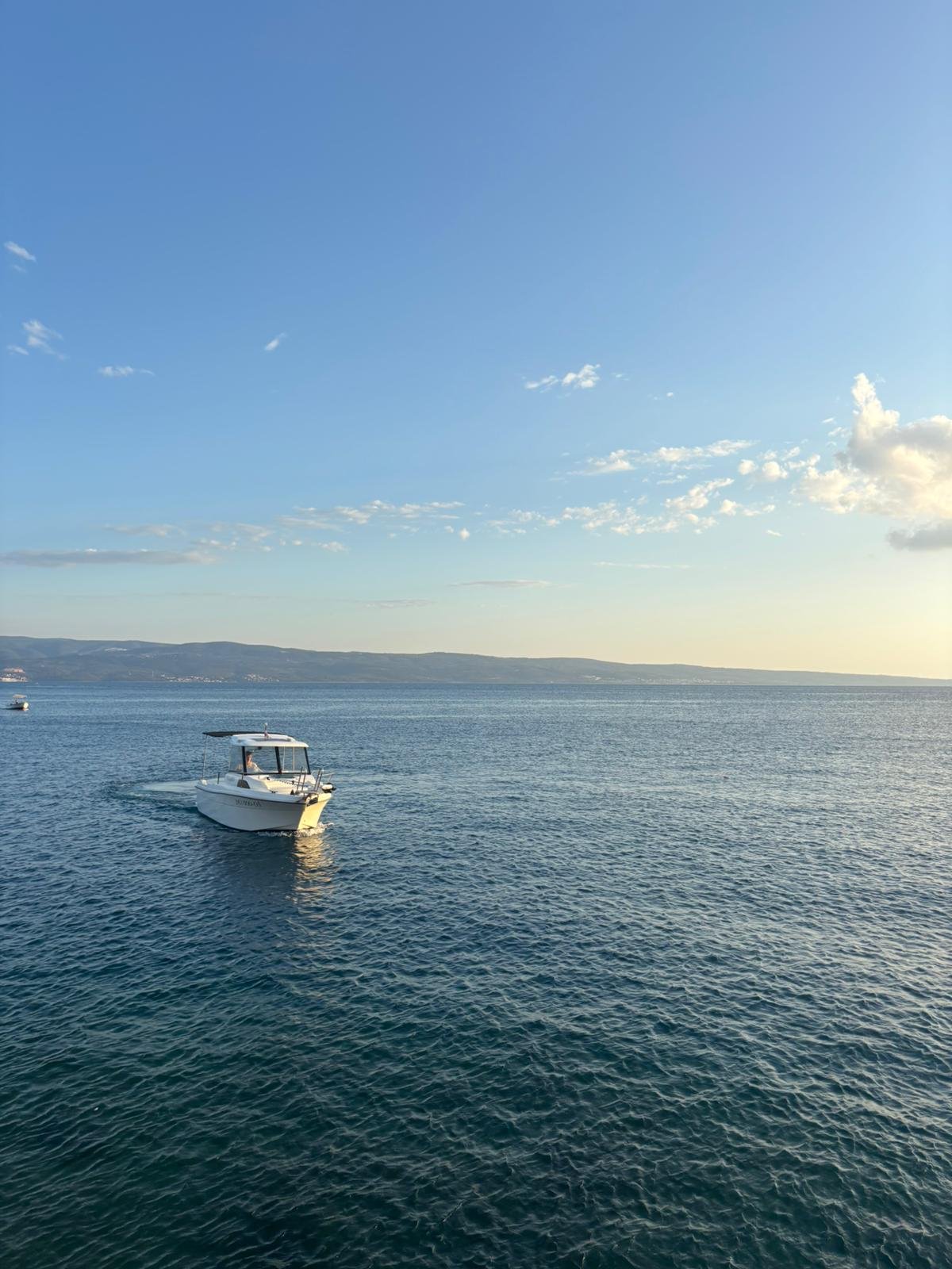Traditional rod fishing at sunset on the Adriatic Sea near Omiš